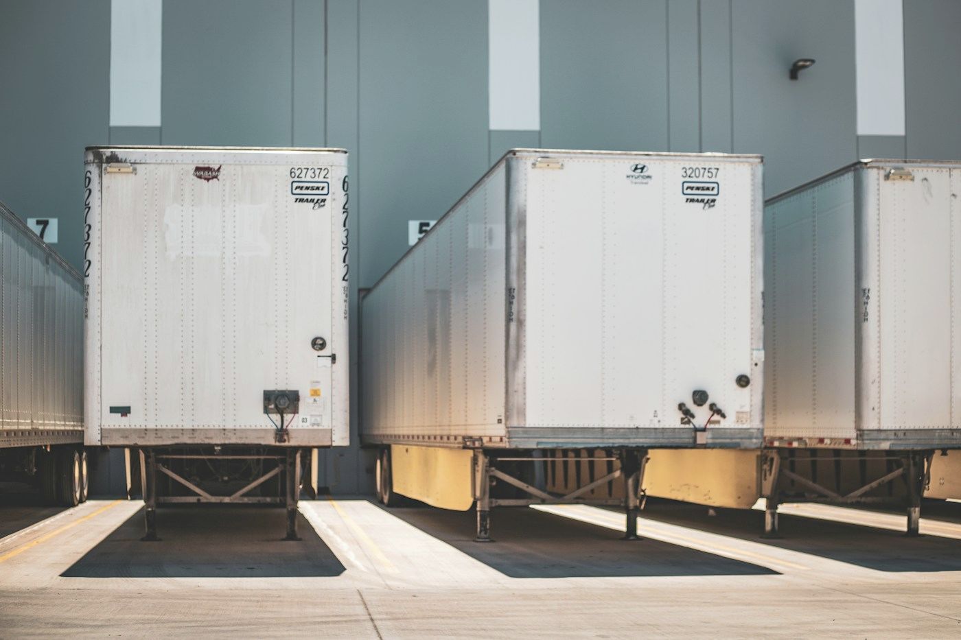 Trailers backed onto a row of dock doors